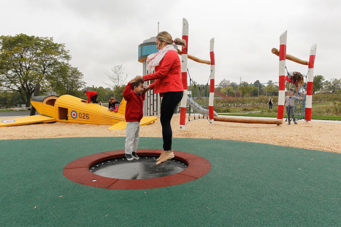 A mom and her kid bouncing on a mini-trampoline at the Play Zone.
