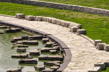 The granite and limestone path at the edge of the lake at Downsview Park.